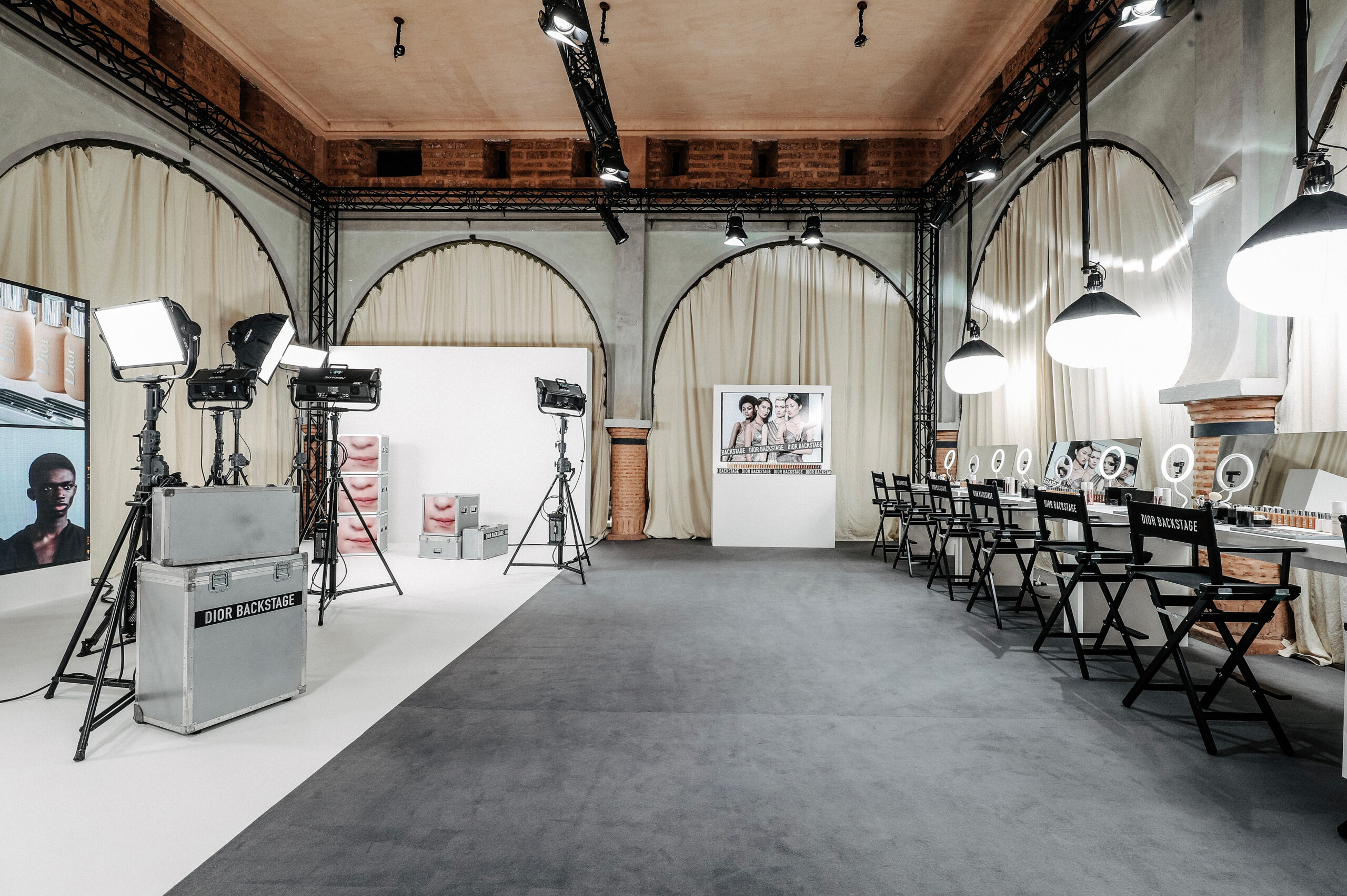 Dior backstage dressing room-inspired design with makeup chairs and light design scenographed by Golden Mama for Dior Beauty Makeup