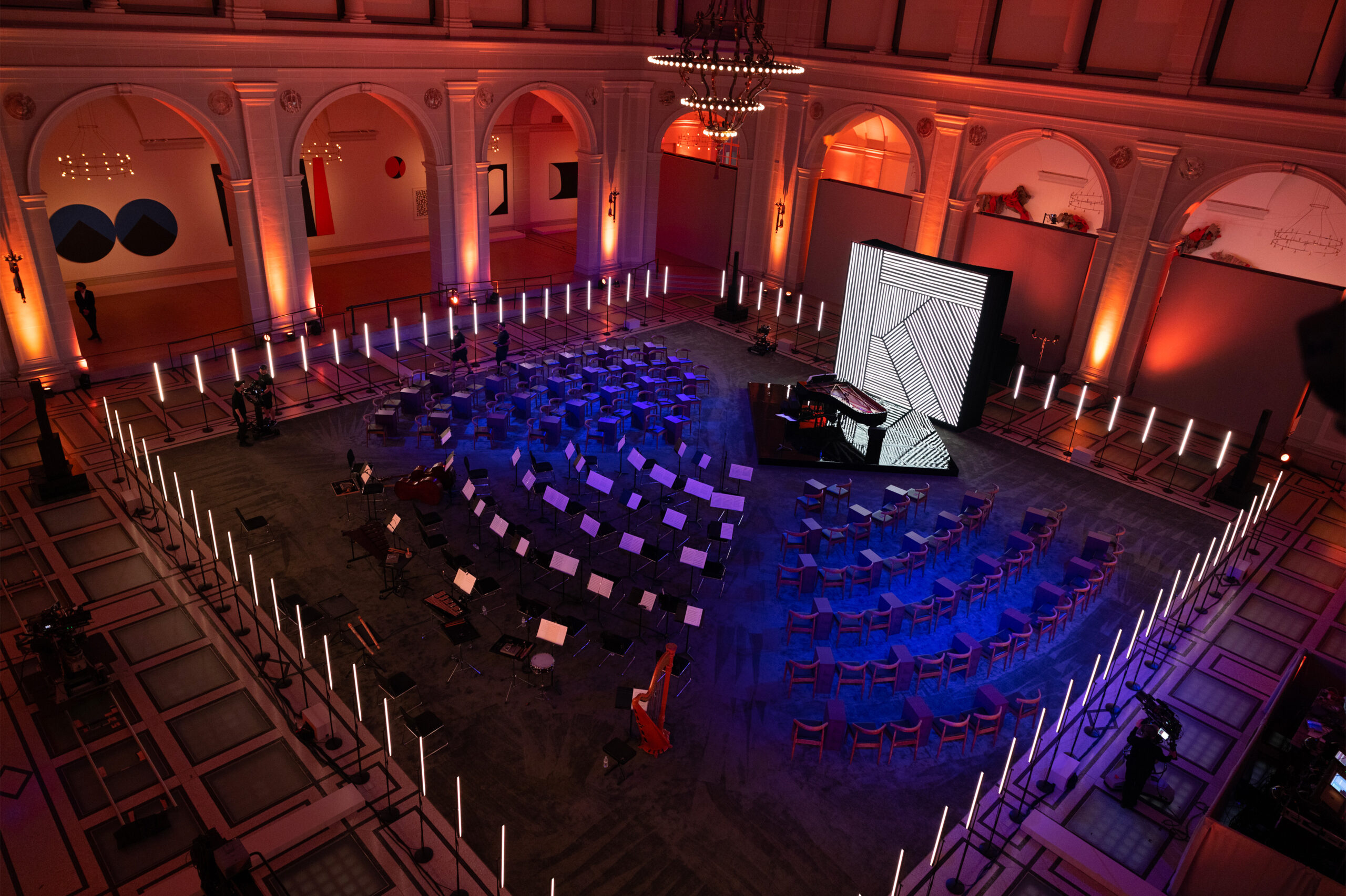 Empty set design of the orchestra sitting arrangement and light display by Collectif Scale for Krug x Ryuichi Sakamoto scenographed by Golden Mama