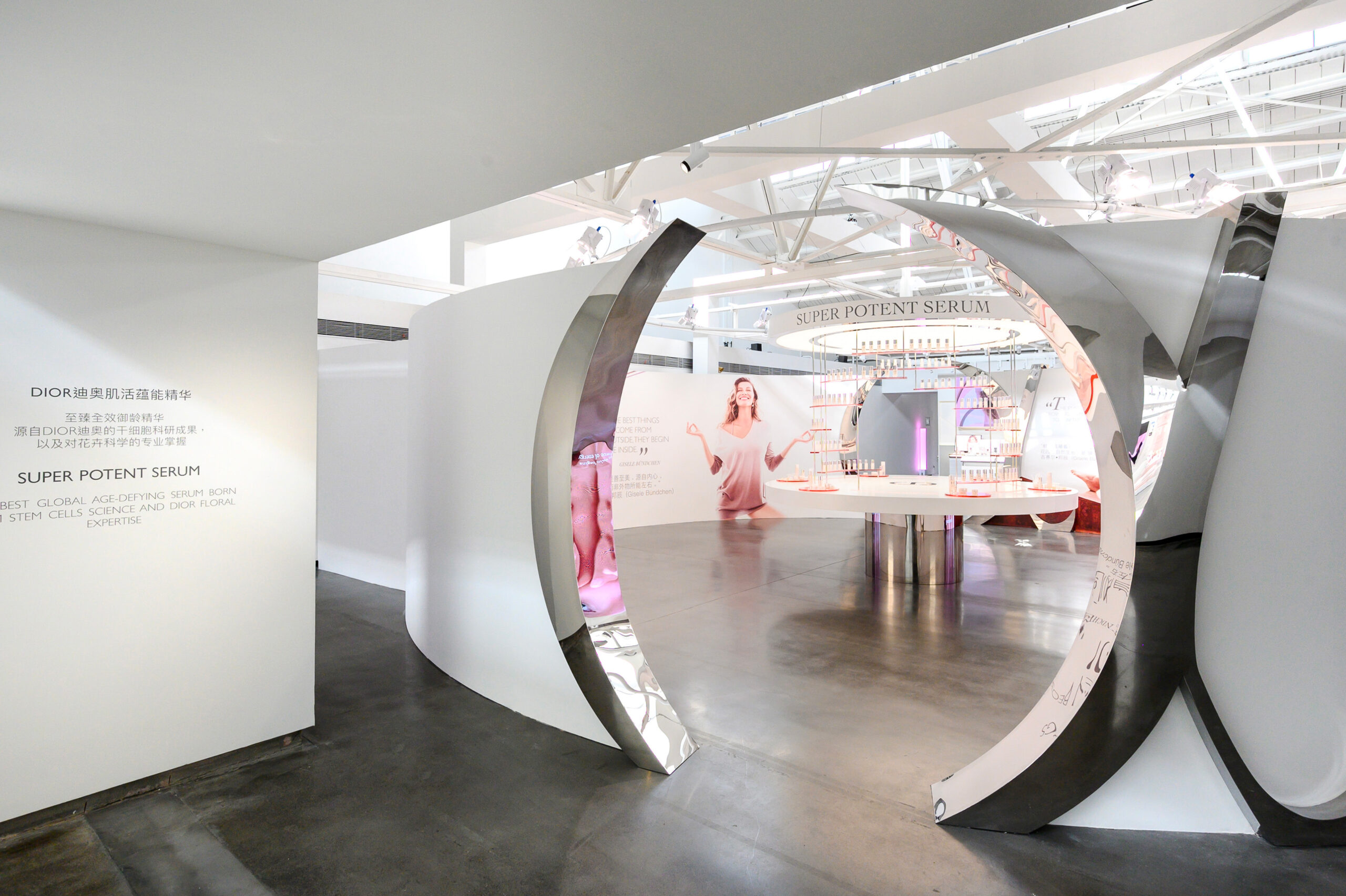 The Dior's Capture Totale muse, Gisele Bündchen, on a wall of the Dior Capture Totale exhibition in Shanghai, event designed by Golden Mama.	